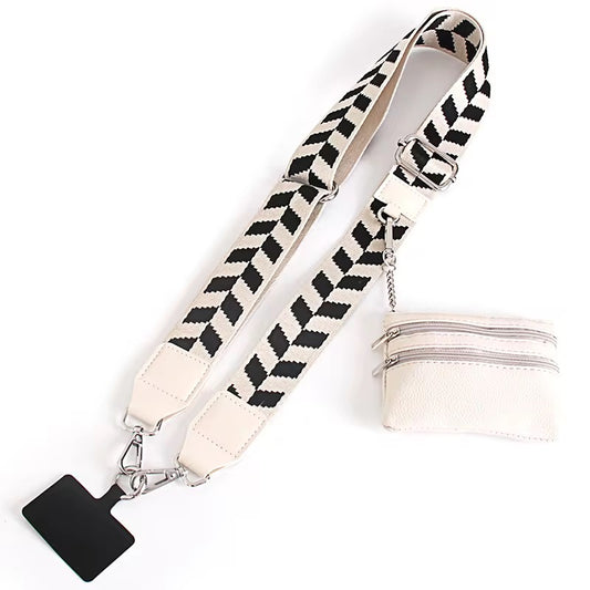 Black and white patterned strap with a clip on a white background