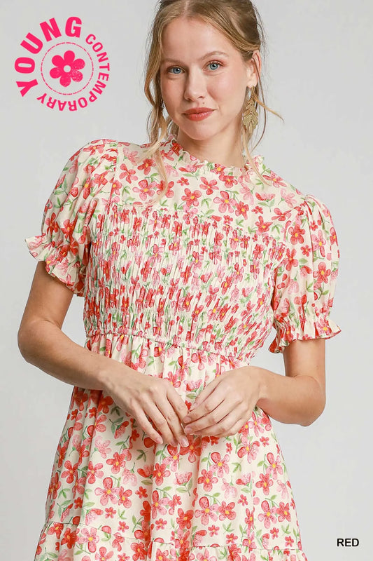 Woman wearing a floral dress with 'Young Contemporary' branding on a light gray background