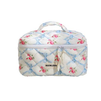 Floral patterned cosmetic bag with 'BEENLOVE' branding on a white background
